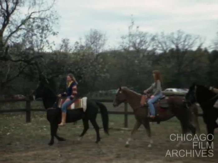Bob Malak and three girls from Tony Cilento's studio are riding horses and Doug Corcoran is making comments about Bob Malak riding. June, 1982.