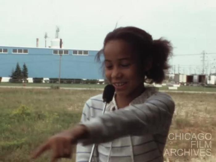 I go down Terrace Avenue to the tune of the song Magic. There is a bulldozer doing some work there. I go to Darcy Whilhelmi's house where her daughter, who is a malato films me. Darcy is white. Then I film the daughter's boyfriend kicking a football. Both of them are about 10. Then I film the dog which is a French poodle and then there is the beginning of the dinner scene. August, 1982.